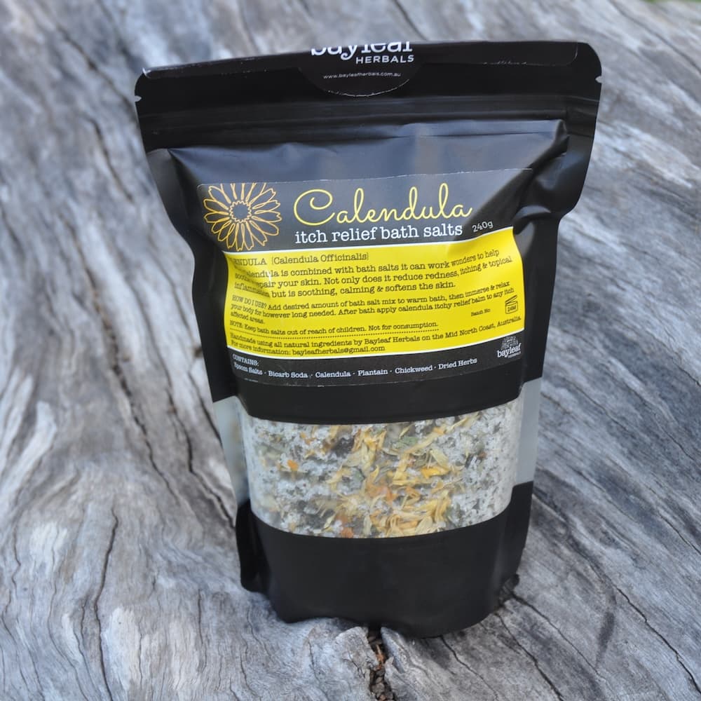Bag of Calendula itch relief bath salts on a wooden surface