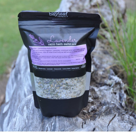 Bayleaf Herbals lavender calm balm bath salts in bag on a log